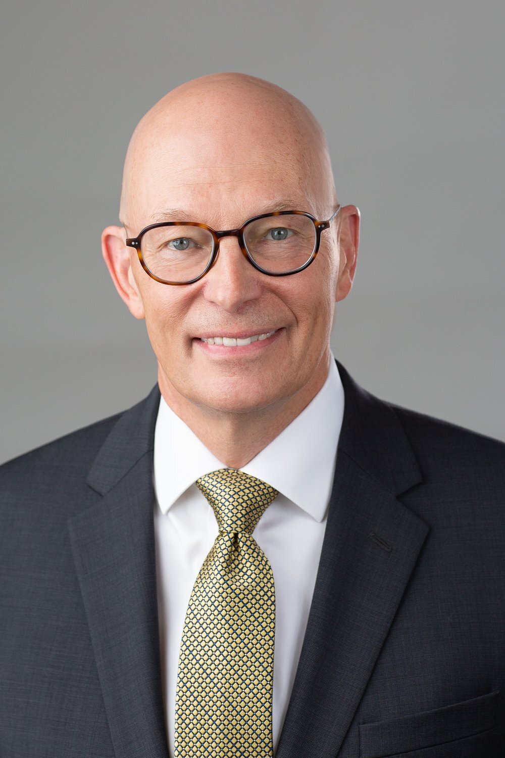 Businessman in tortoisell glasses