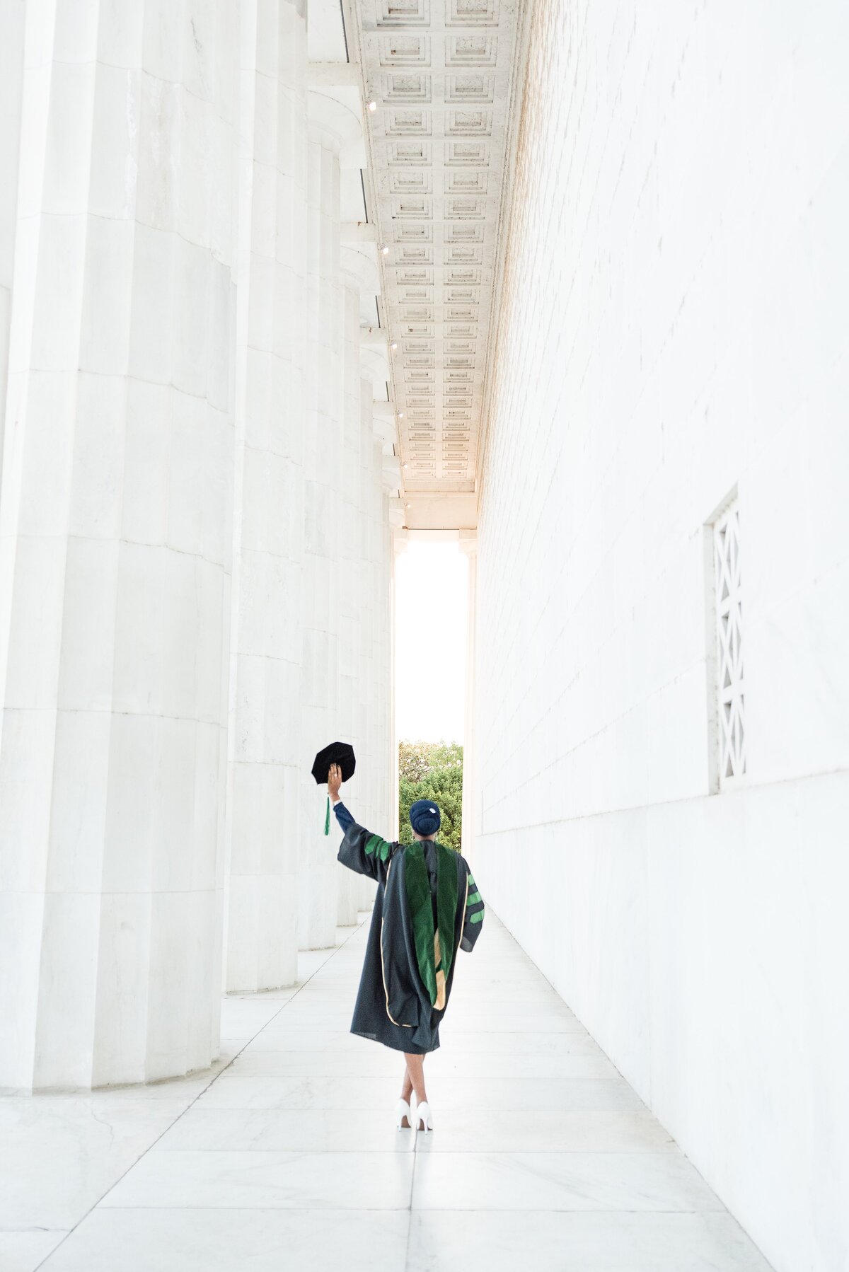 grad med school holding cap