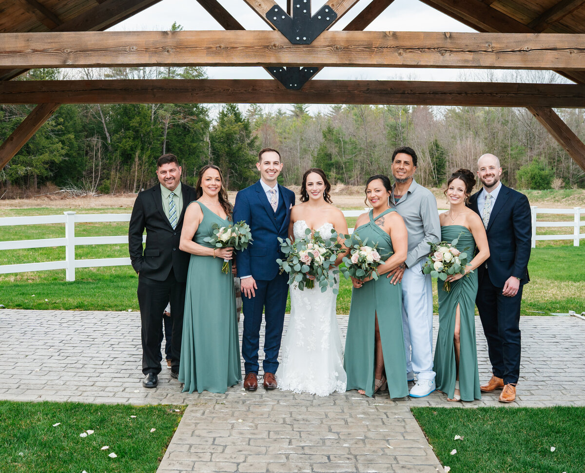 Elegant wedding flat lay with rings, florals, and invitations