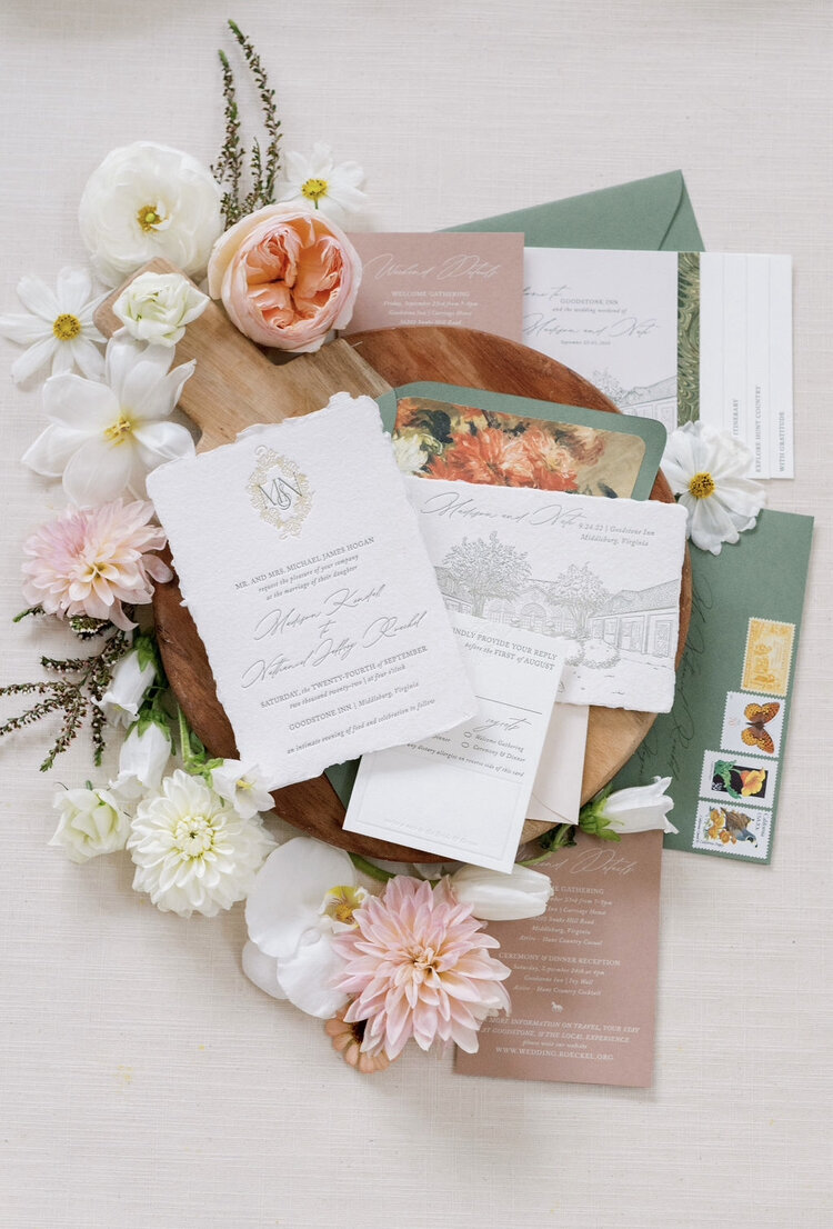 Elegant wedding details with invitation, menu, bands and floral details