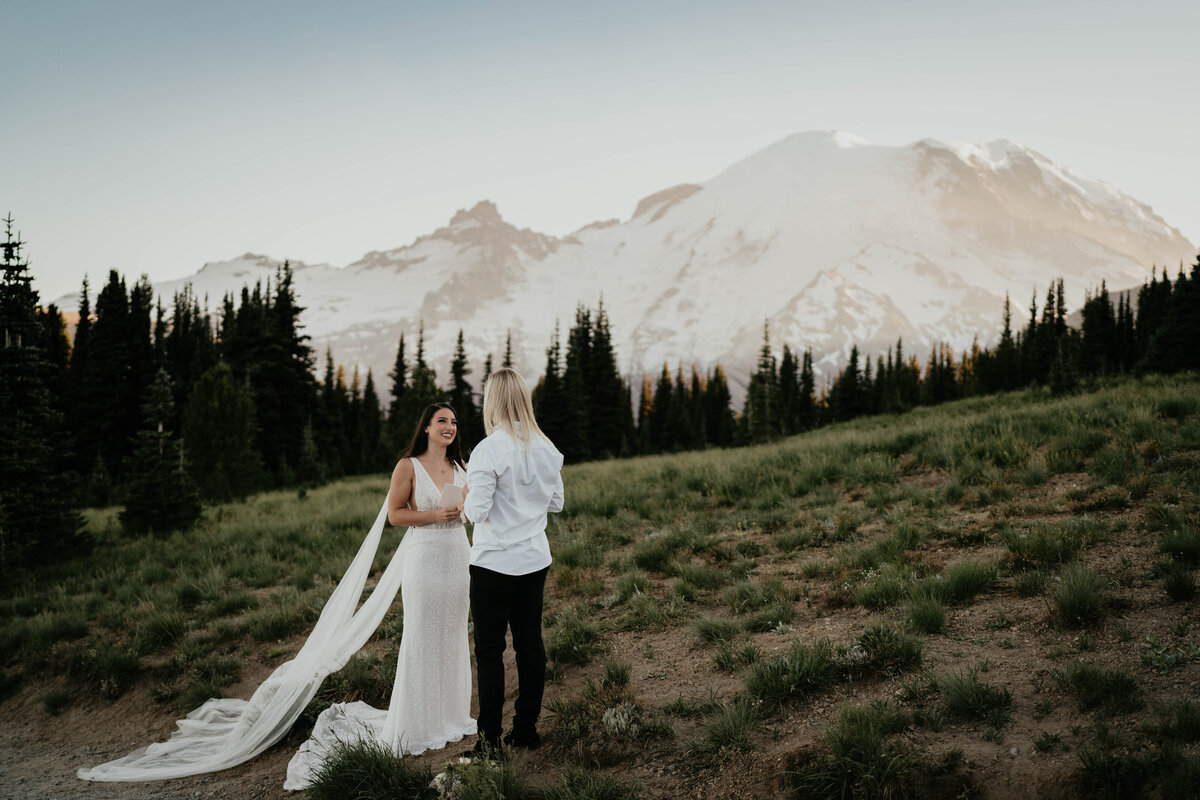 LGBTQ couple exchanging vows at Mt. Rainier elopement