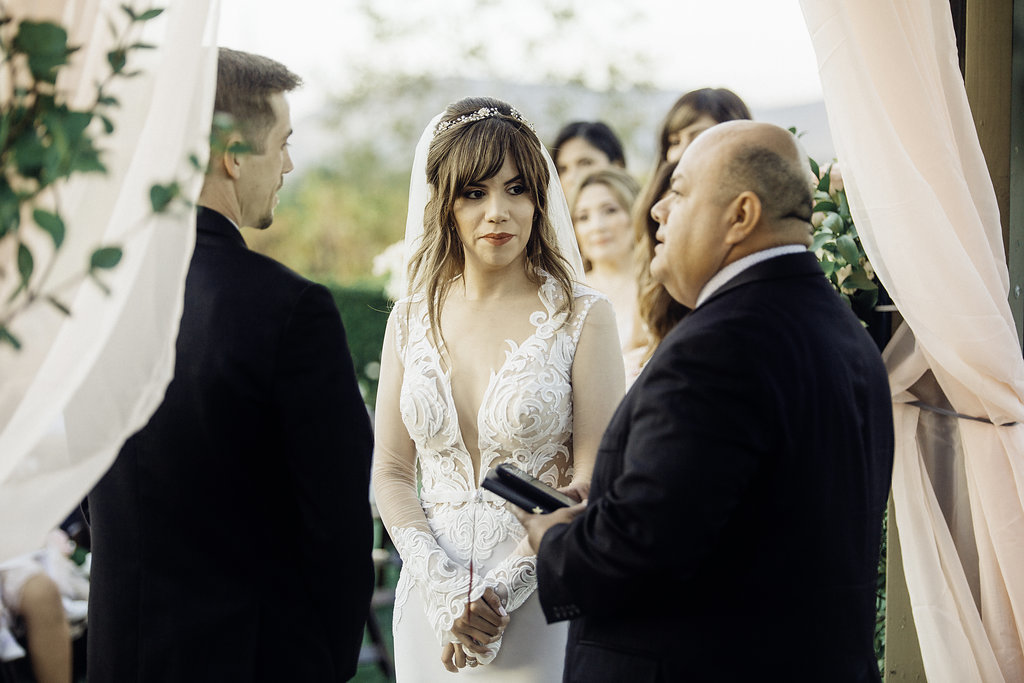 Wedding Photograph Of Pastor Speaking To Bride And Groom Los Angeles