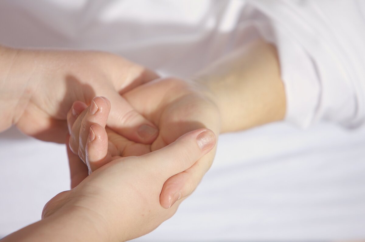 photo of a hand being massaged