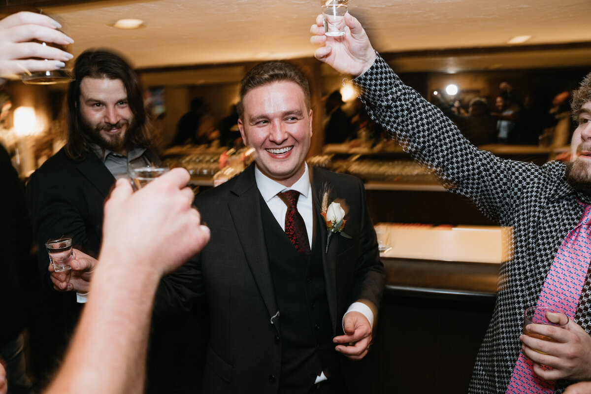 Groom does shots with friends