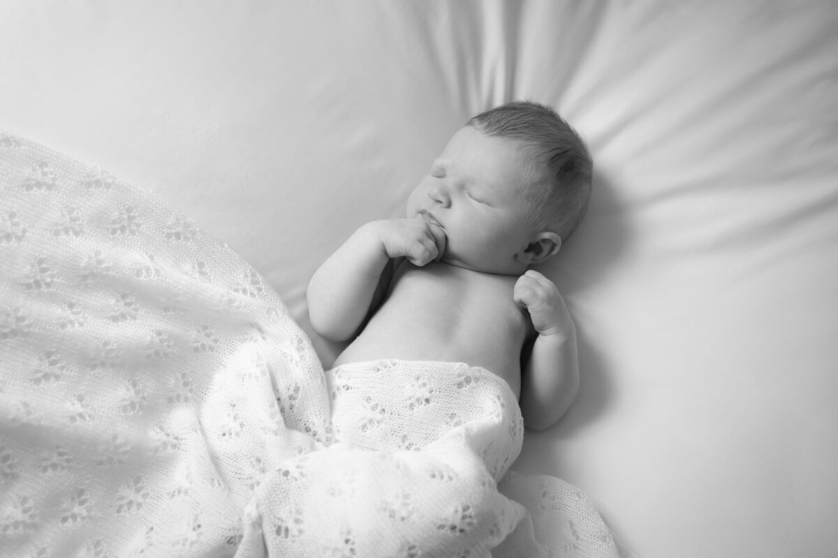 Vanessa is an experienced newborn family photographer in Godalming