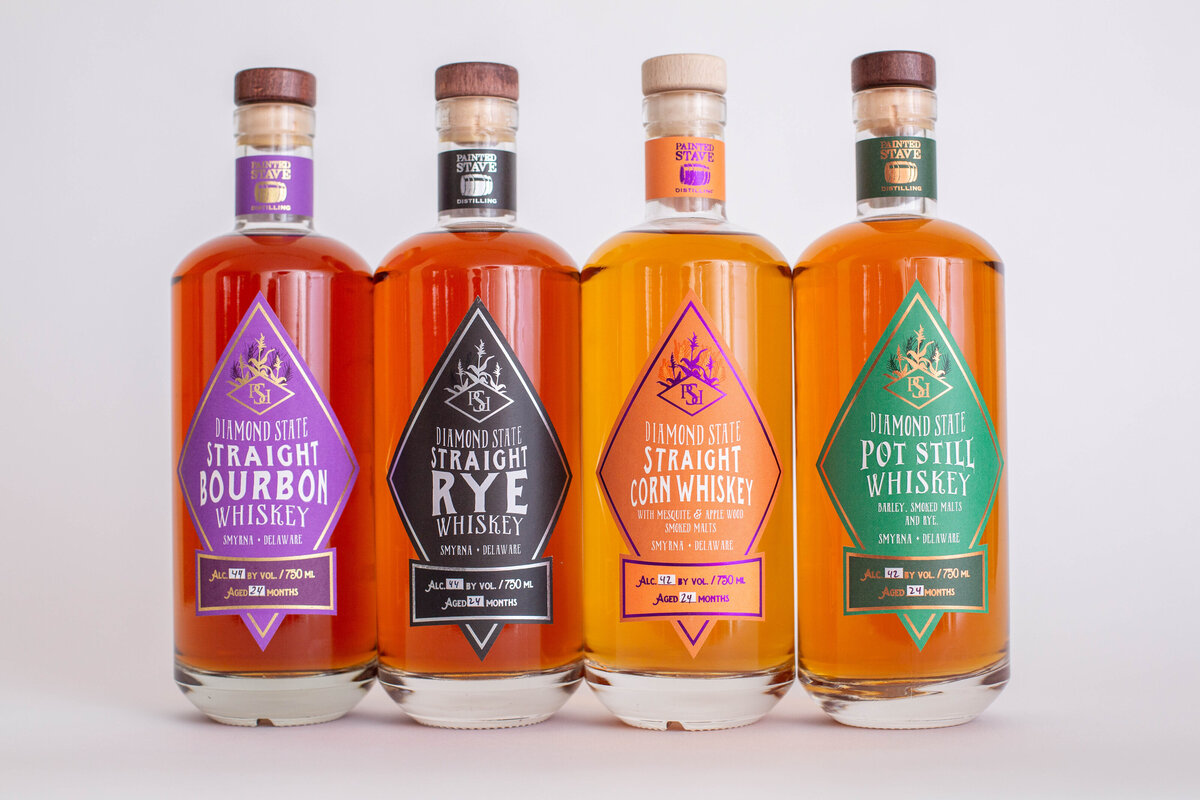 Set of 4 bourbon bottles with different lables