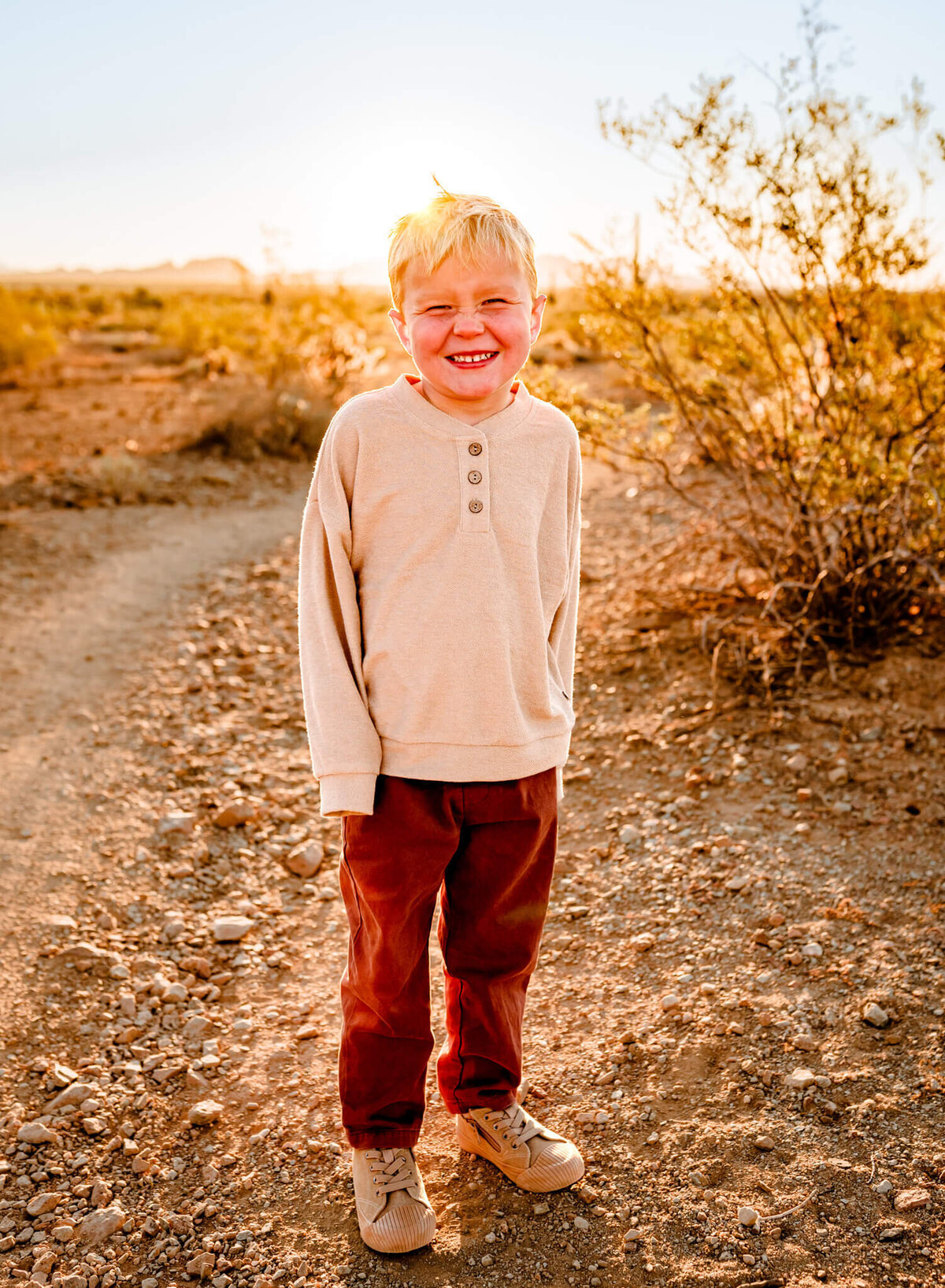 son smiling during family photography session in Arizona winter