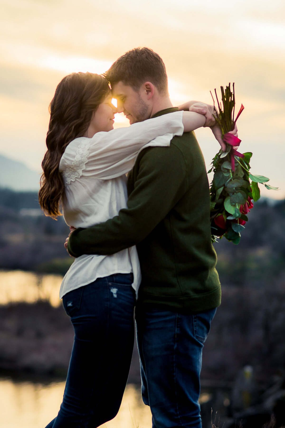 engaged couple with foreheads touching