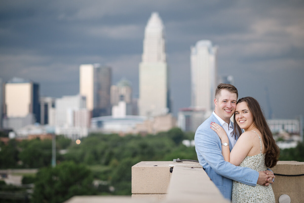 Charlotte proposal photographer captures joyful moment of engaged couple in Uptown Charlotte during a surprise engagement session.