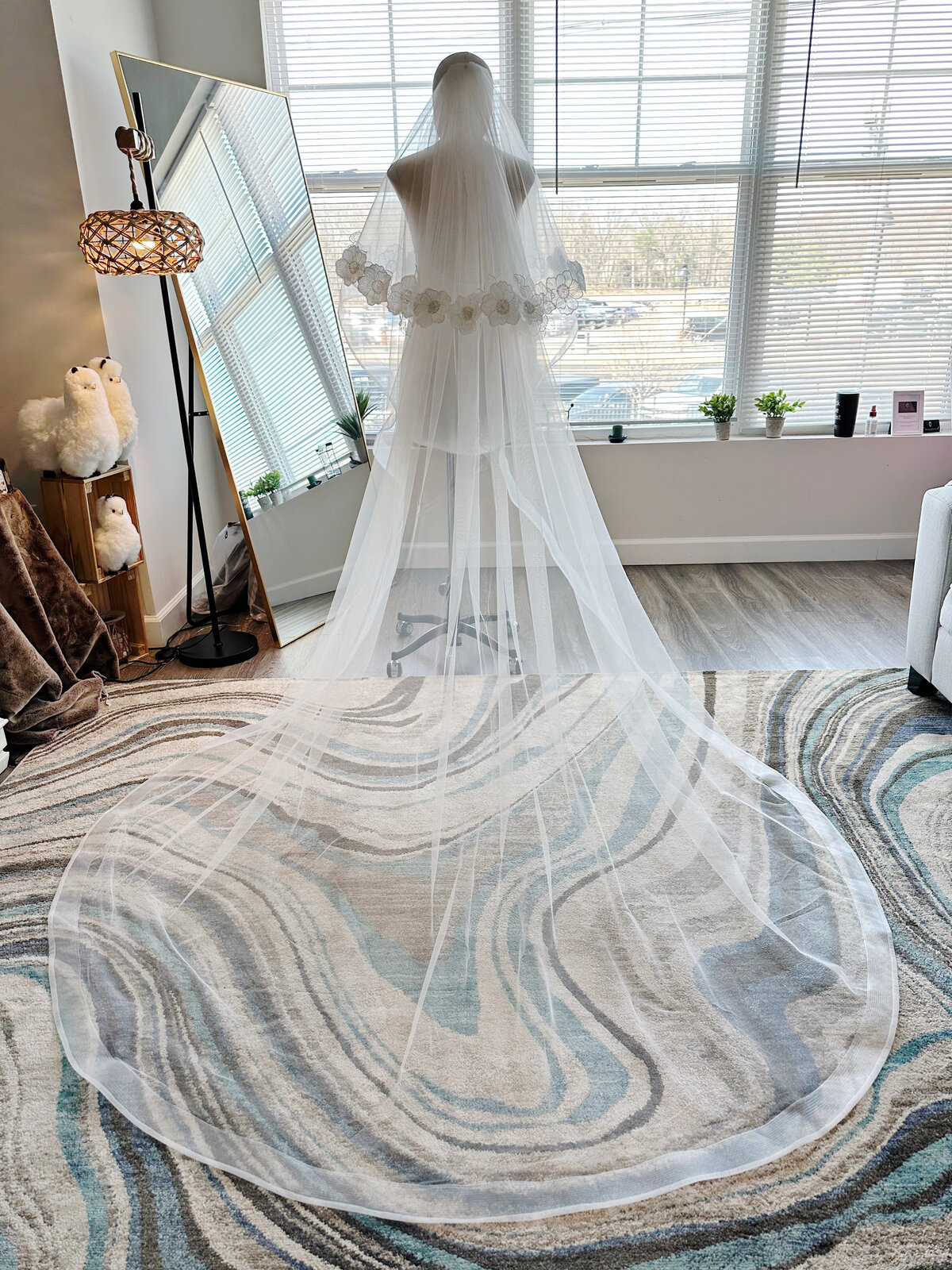 Fine lace blusher veil adding soft romantic touch to gown
