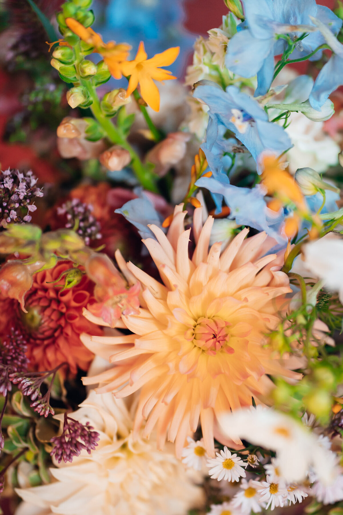 Gloucestershire-wedding-photographer-colourful-bridal-bouquet-at-pauntley-court