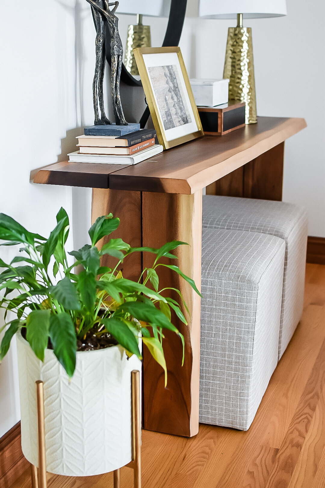 A small living room console table sits in the corner