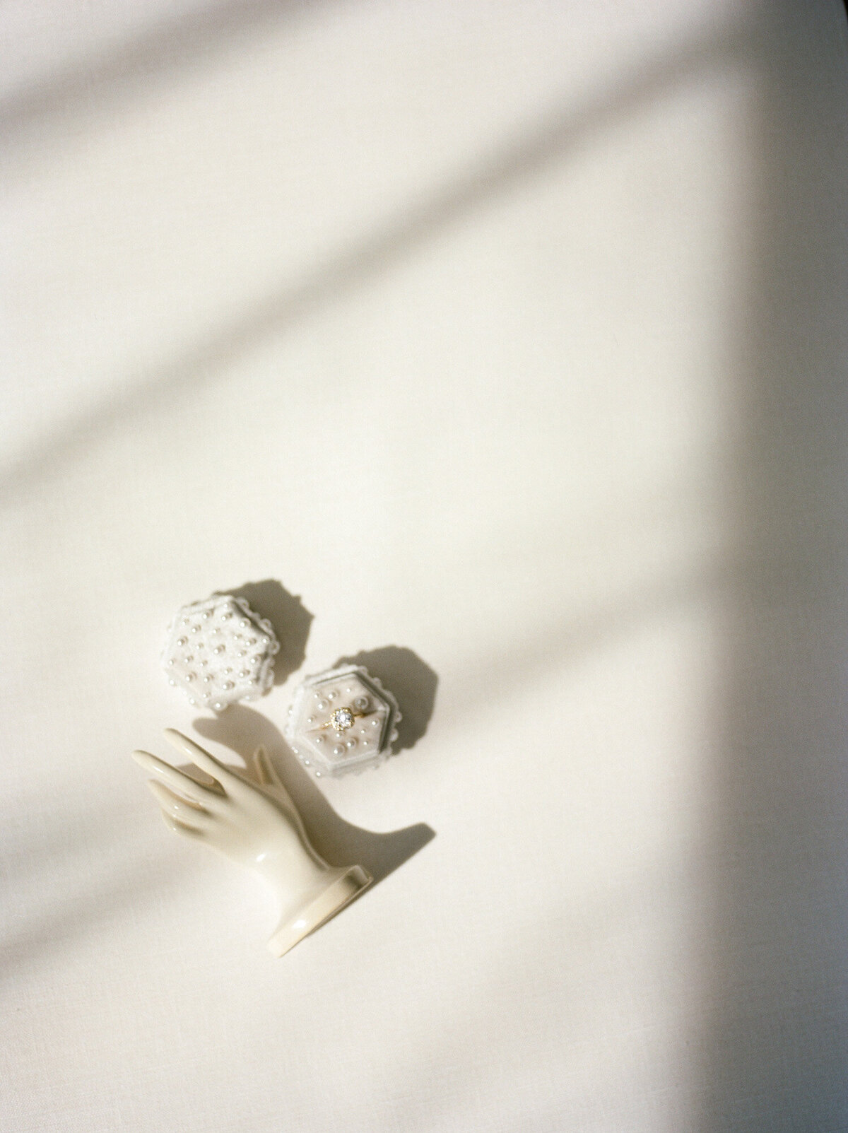 ethereal, soft flat lay, film florist photos, wedding, pearl-studded ring box, hand