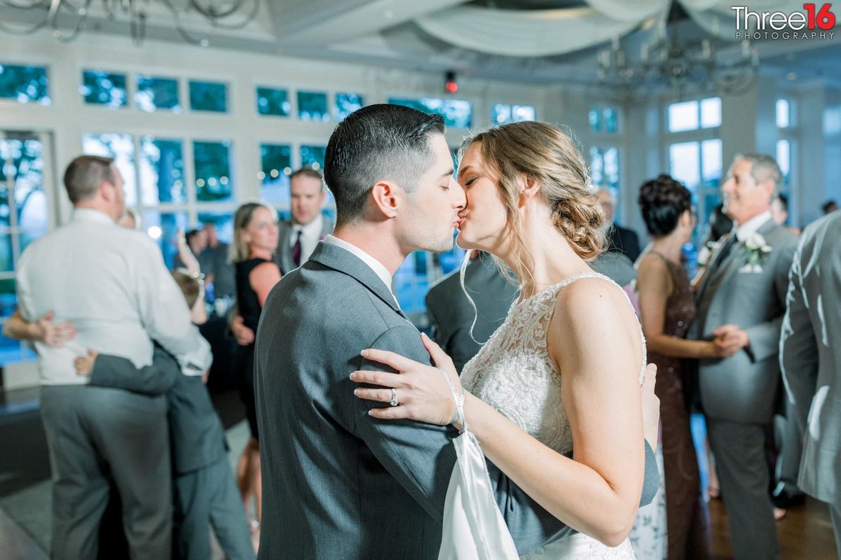 Bride and Groom share a kiss on the dancefloor