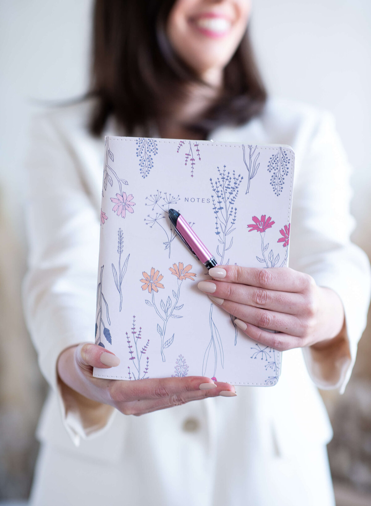 Ottawa branding photos of a closeup photo of a woman holding a journal and pen.  Captured by JEMMAN Photography