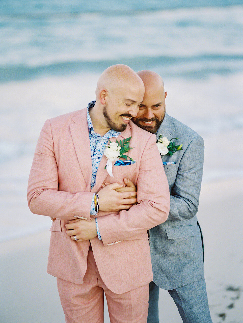 Gay couple portrait at beach destination wedding