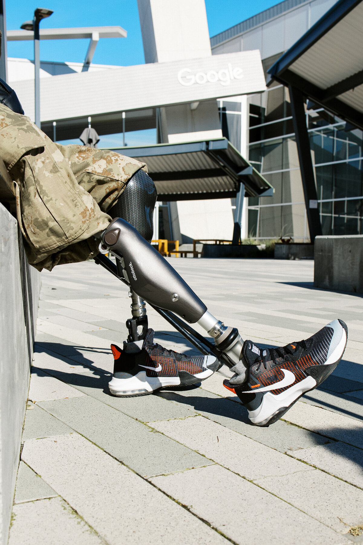 Ukrainian soldier sitting and resting with his prosthetic leg at Google Headquarters