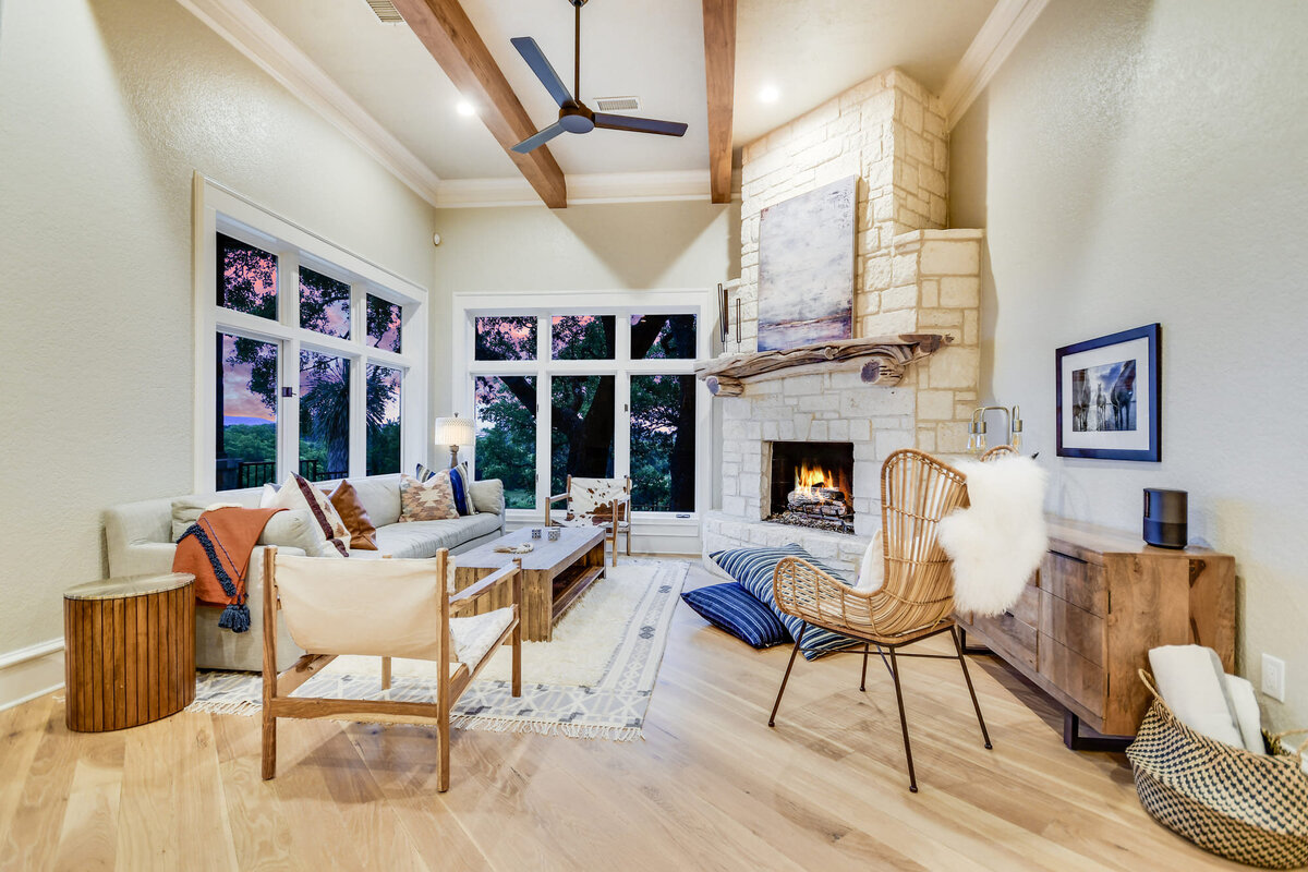 Large family living room with fireplace and art frame above fireplace