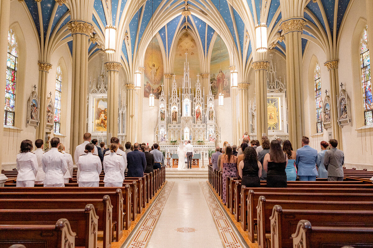 Wedding guests standing in wedding chapel