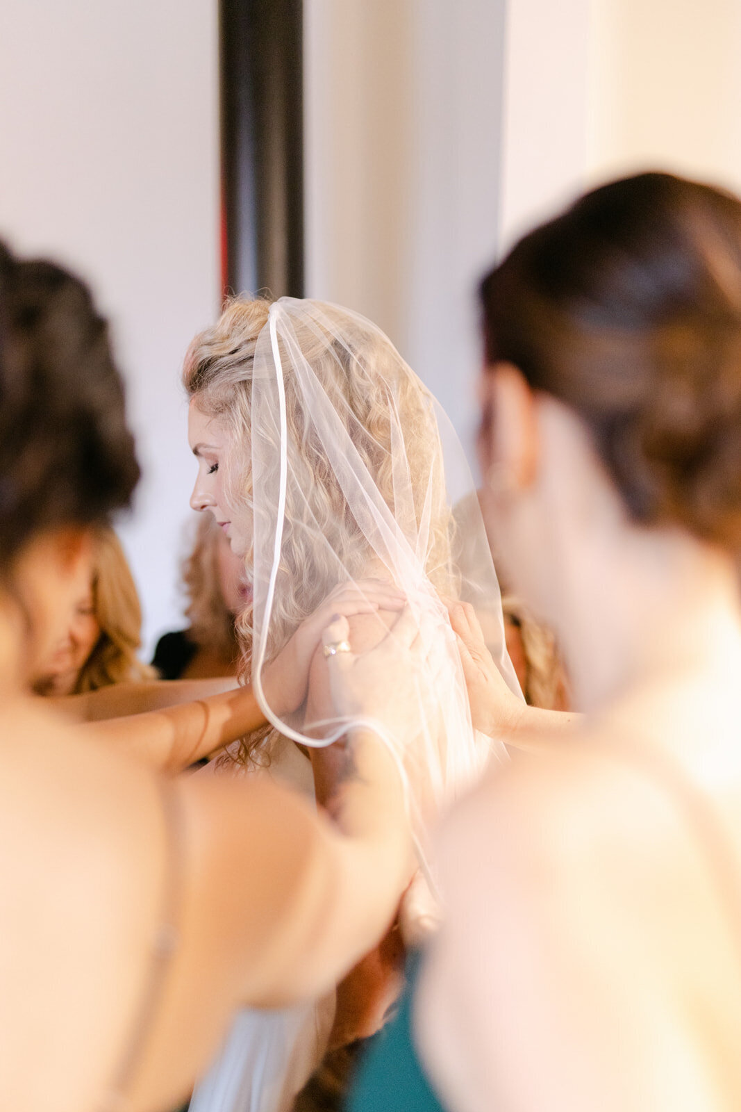 bridesmaids-praying-over-the-bride-before-she-walks-down-the-aisle-britt-stepp-photography