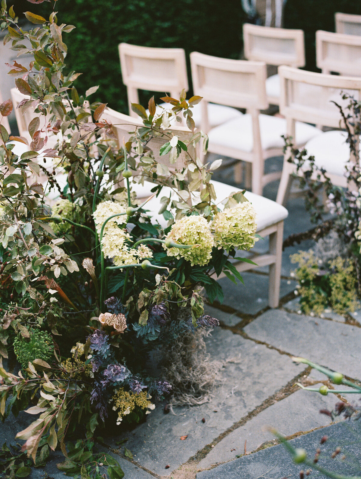 Ceremony florals captured on film at Greencrest Manor by Lexie Vaccaro