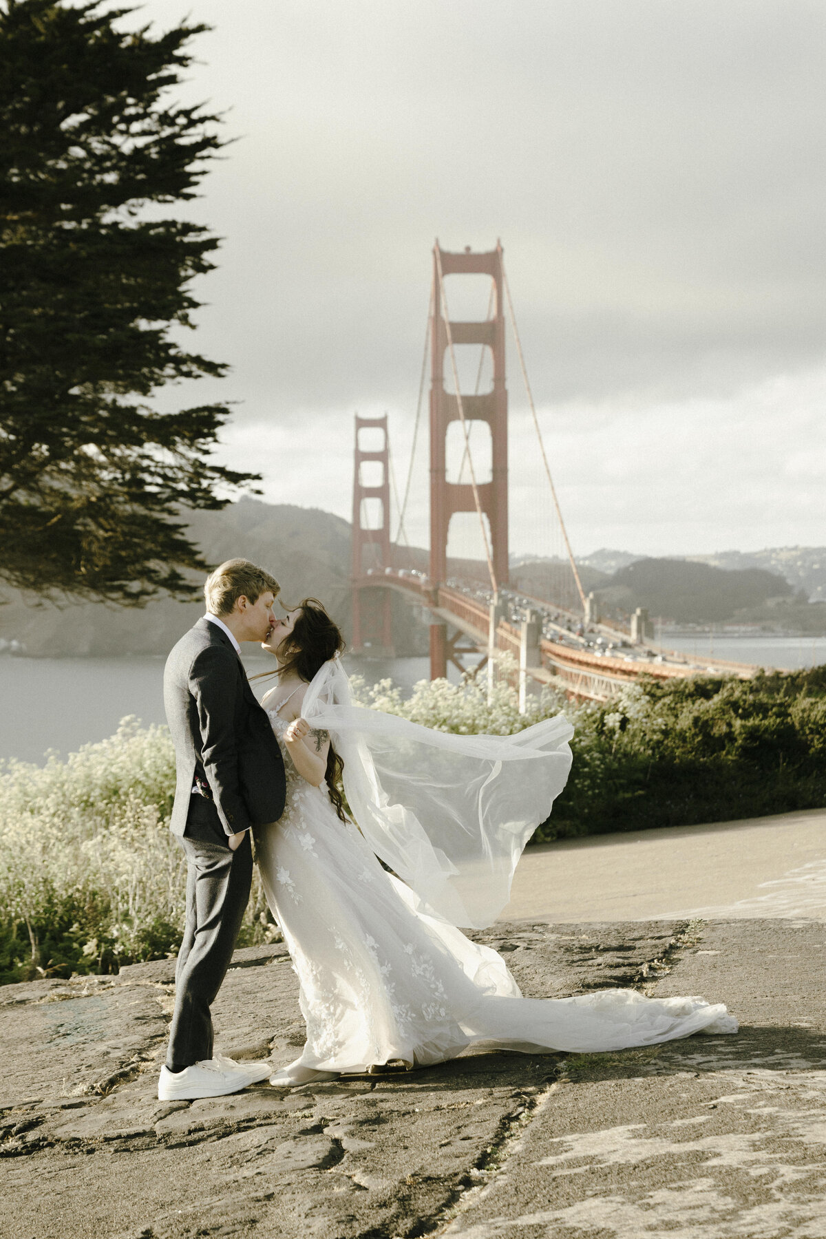 Bride and Groom at Marshall's Beach in San Francisco, California at sunset