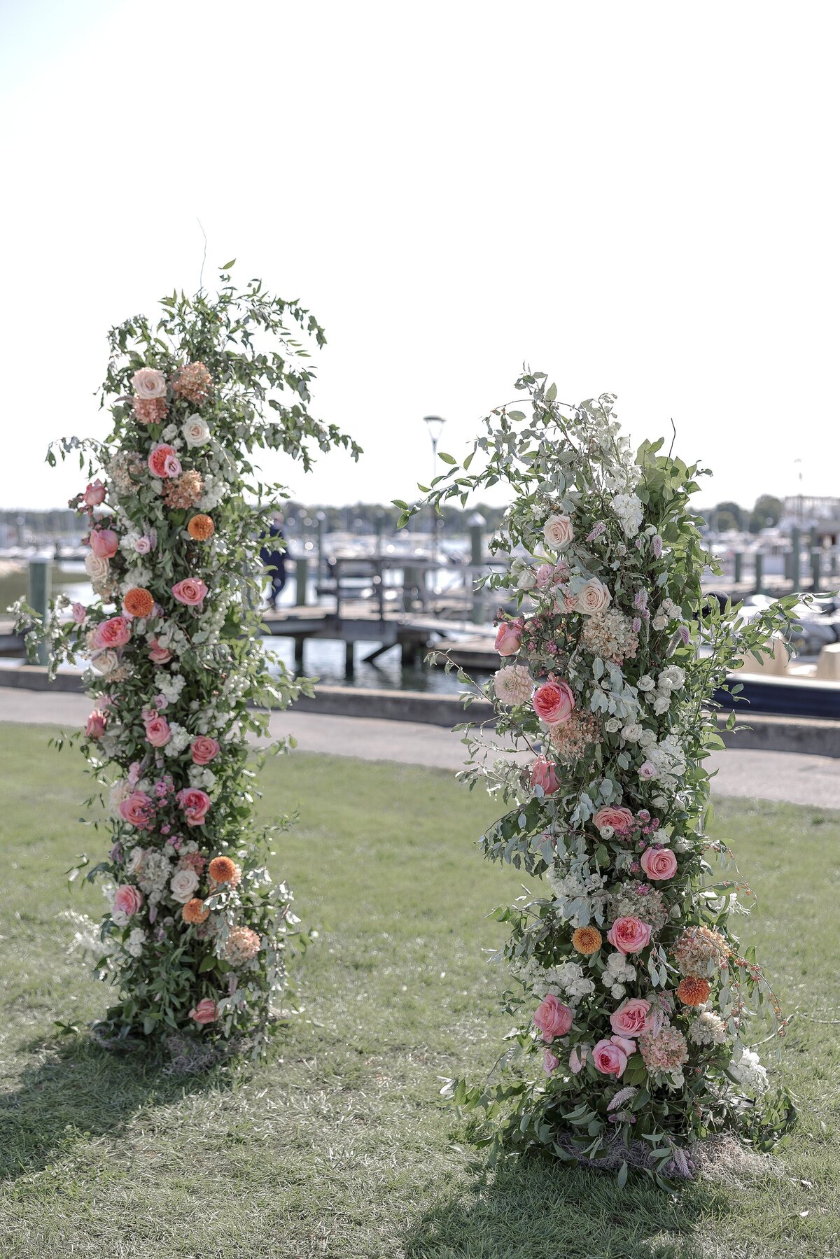 Pink and Green floral arch for South Dartmouth Wedding ceremony.