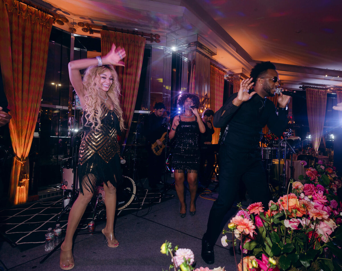 A wedding photo of the band members performing during the wedding reception