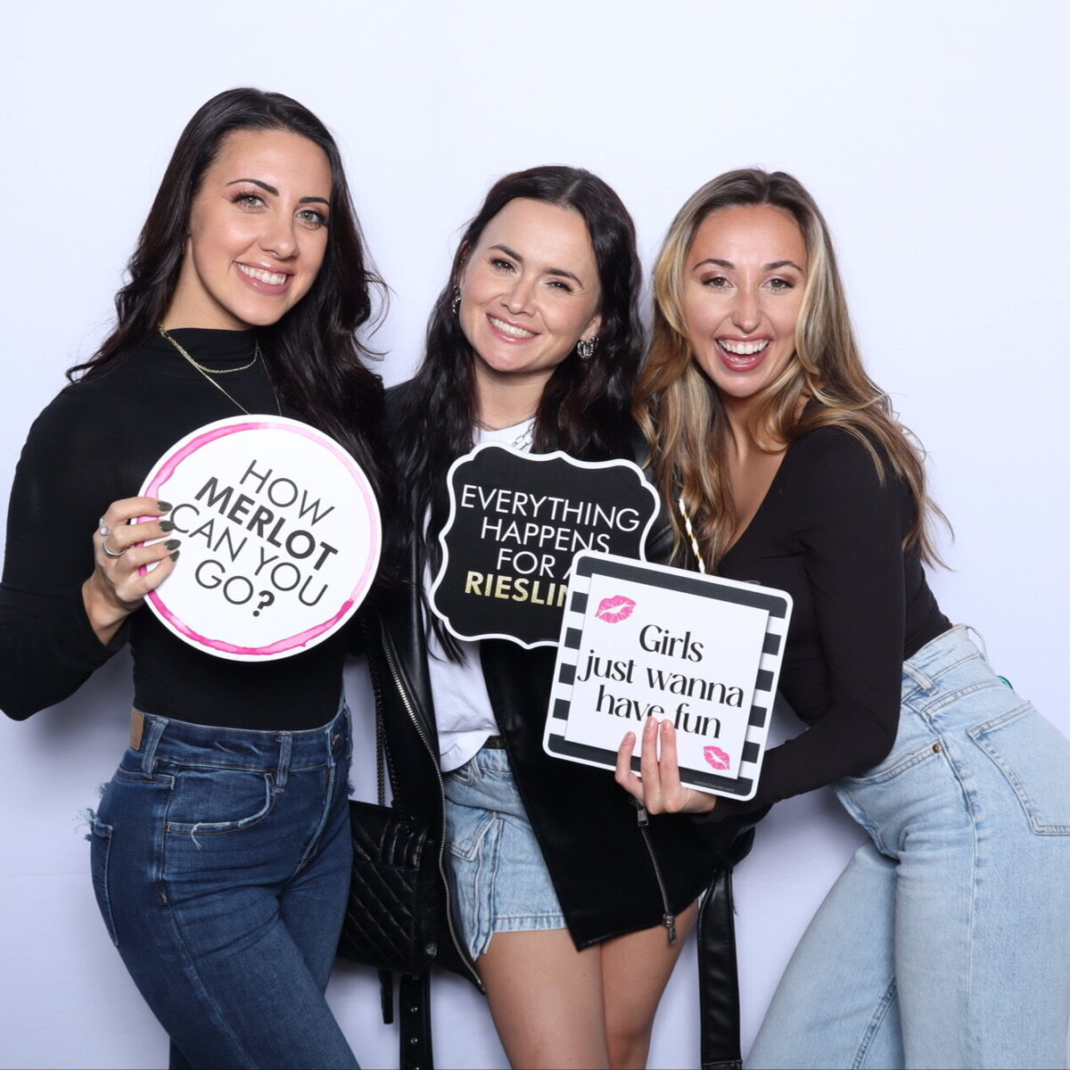 ar-photobooths-three-women-holding-photo-props