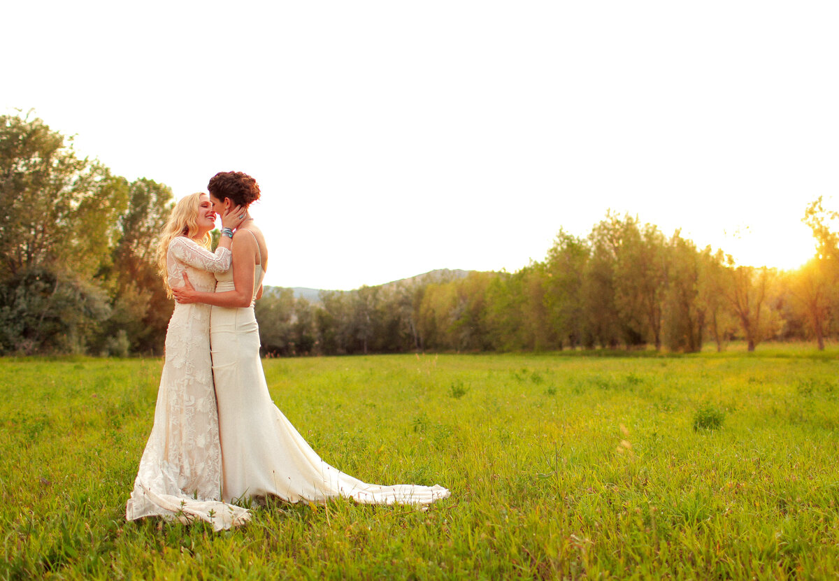 2 Brides Kissing in a Field