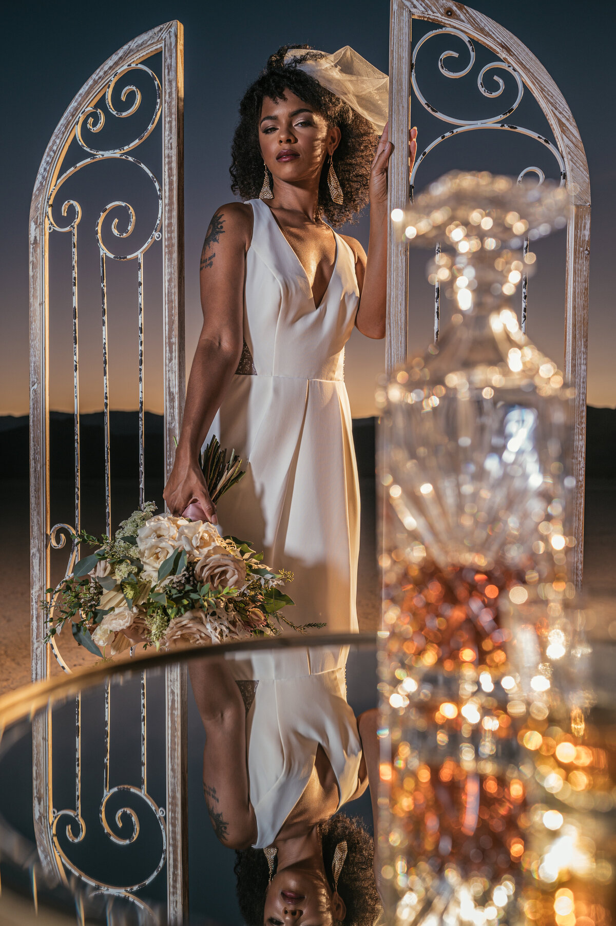 Mirrored table Whiskey decanter dry lake bed bride poc short veil reflection  flowers by michelle sunset golden hour mk delacy photography las vegas wedding photography  las vegas wedding photographers