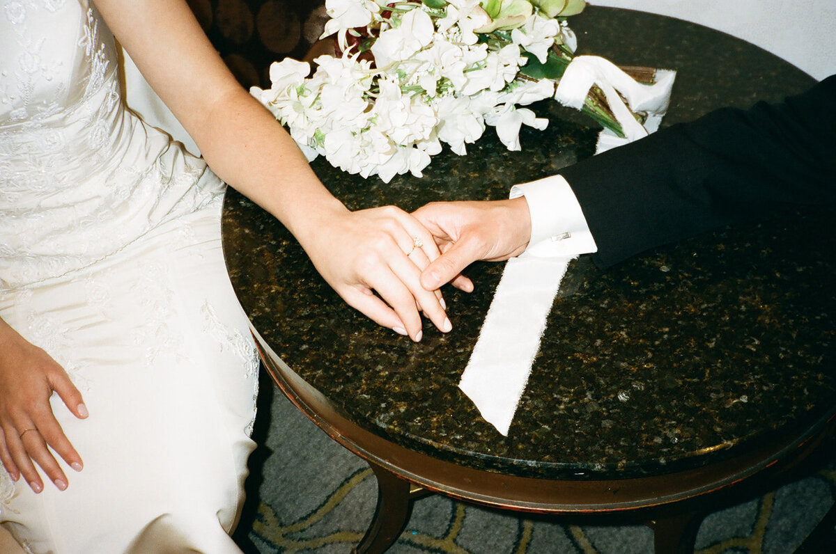 couple in San Francisco holding hands at the Fairmont Hotel