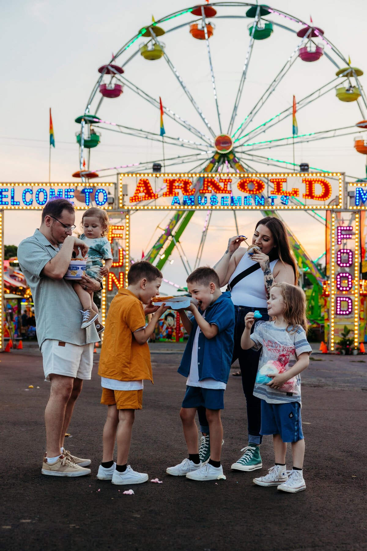 Family eating fair food at the Ionia Free Fair. 
