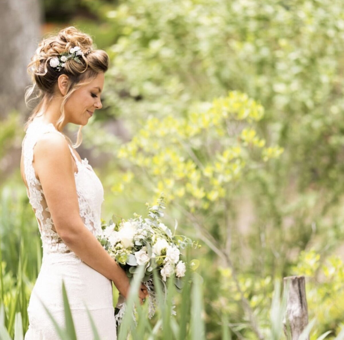 Bride with updo wearing flowers in hair