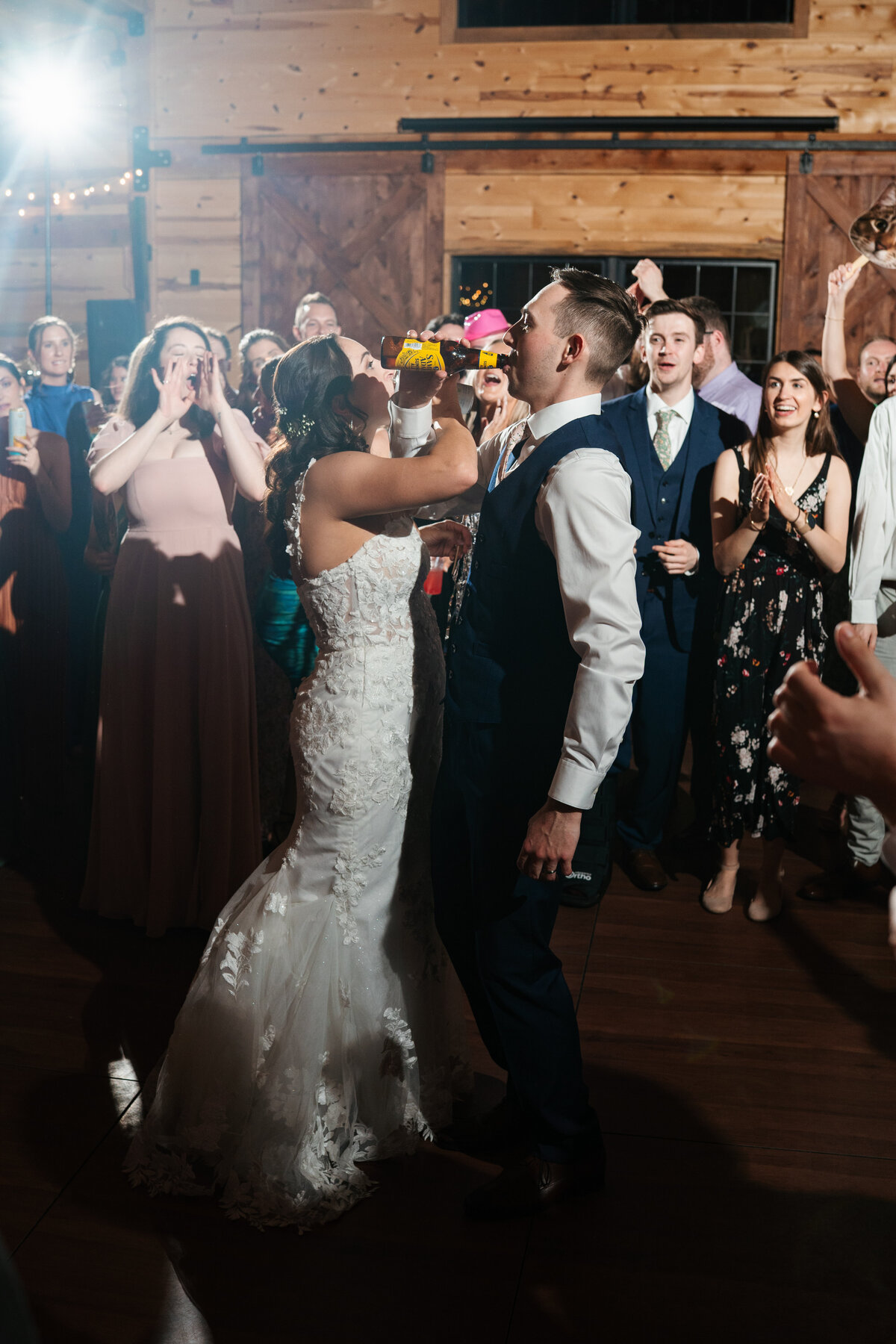Elegant reception setup with candles, florals, and wooden tables