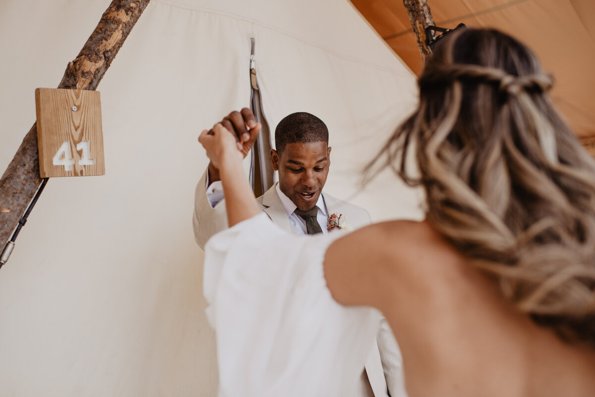 Utah Elopement Photographer captures man looking at woman for the first time in wedding dress