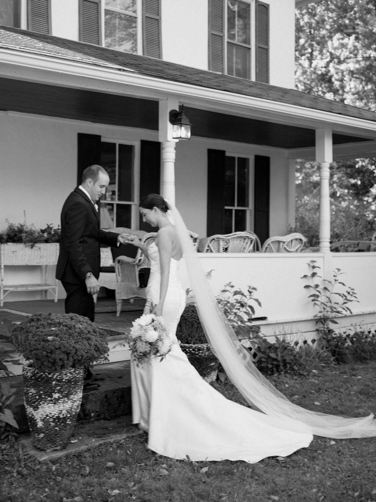 Bride and groom walking moment during their private residence tented wedding.