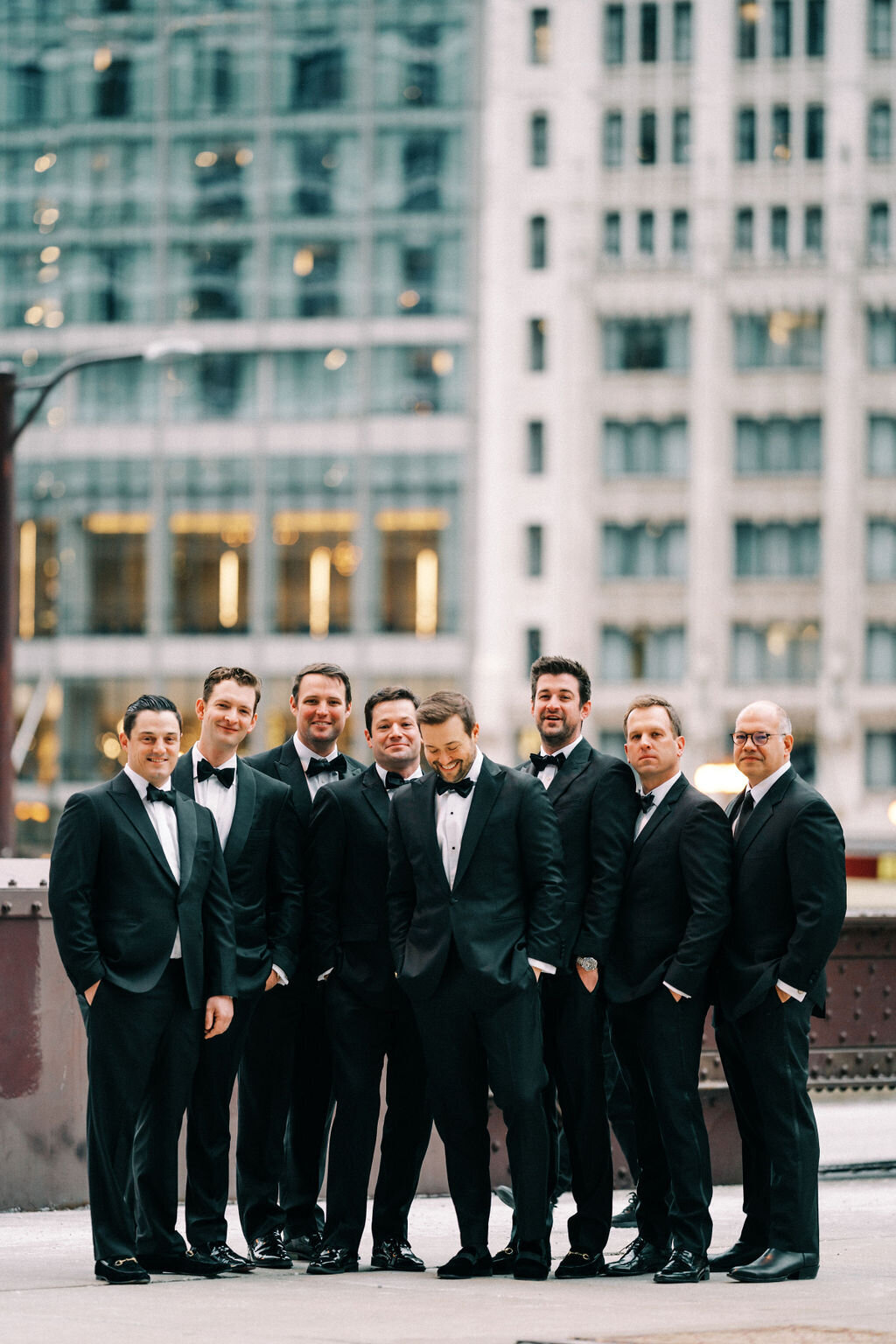 A group of photo of the groom and groomsmen outside in downtown Chicago. 