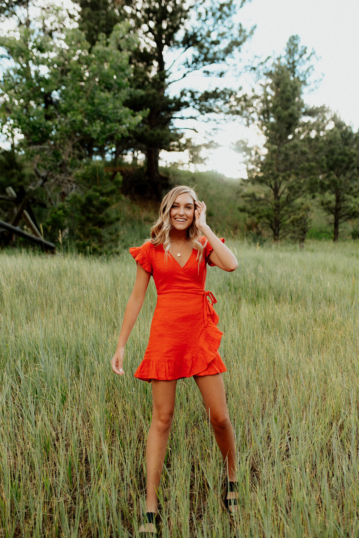Fort Collins high School senior girl pictured in a field near fort collins