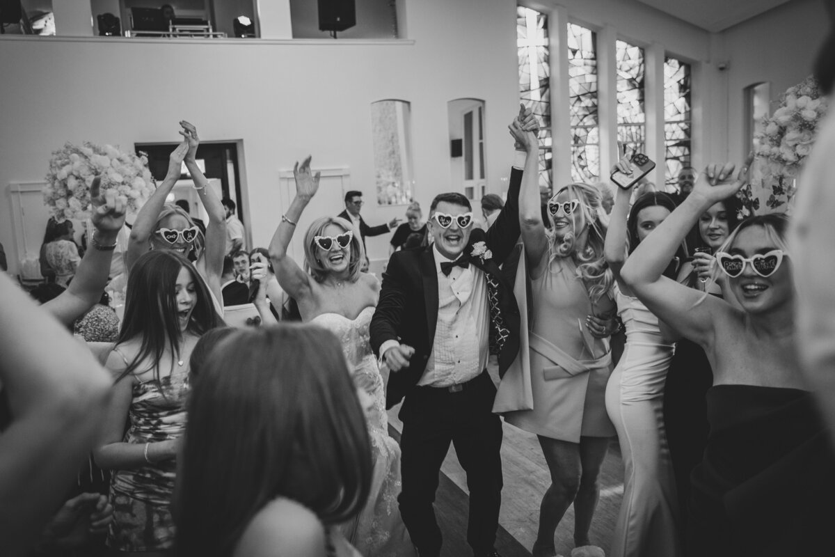 Lots of wedding guests dancing