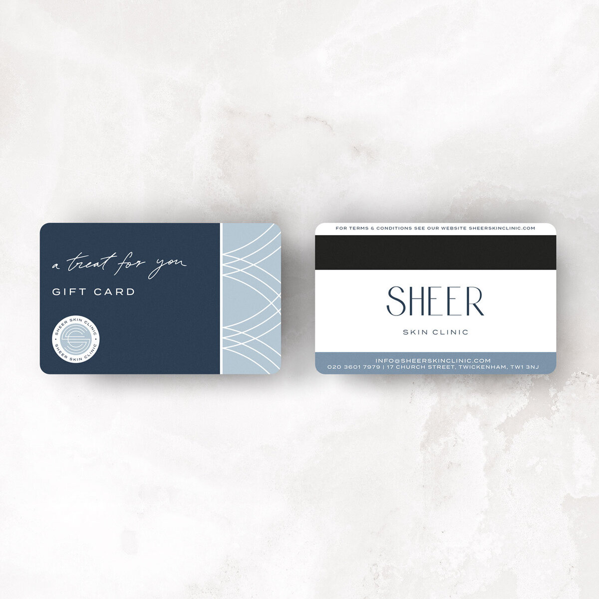 Luxury gift card design with soft blue pattern for Sheer Skin Clinic branding