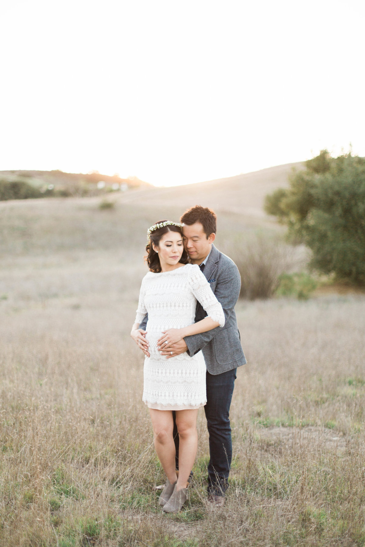 A pregnant mom and her husband during golden hour in Denver