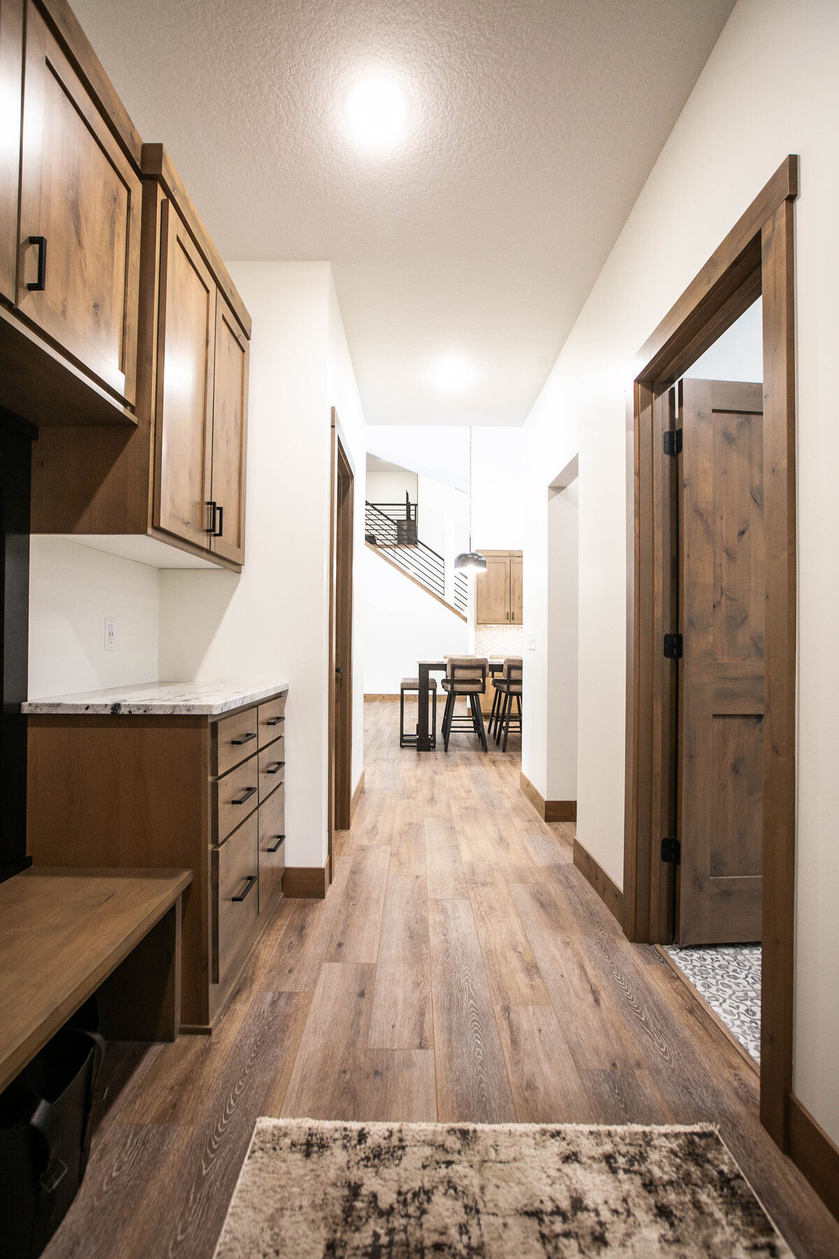 Laundry and mudroom combo with built-in storage and utility sink in Elk River forever home