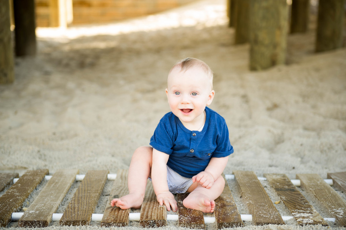 little boy on boardwalk