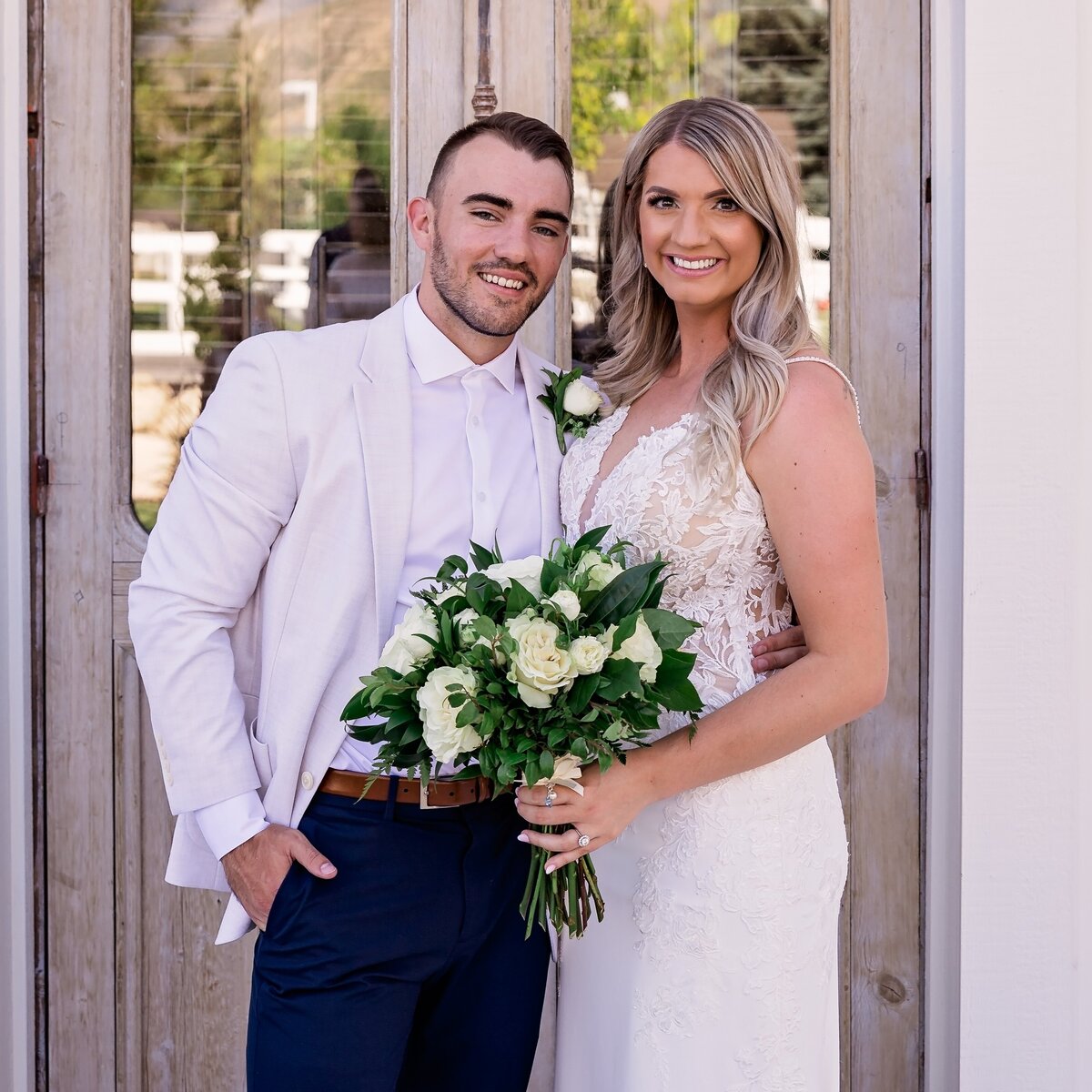 bride-and-groom-holding-flowers-at-walker-farms