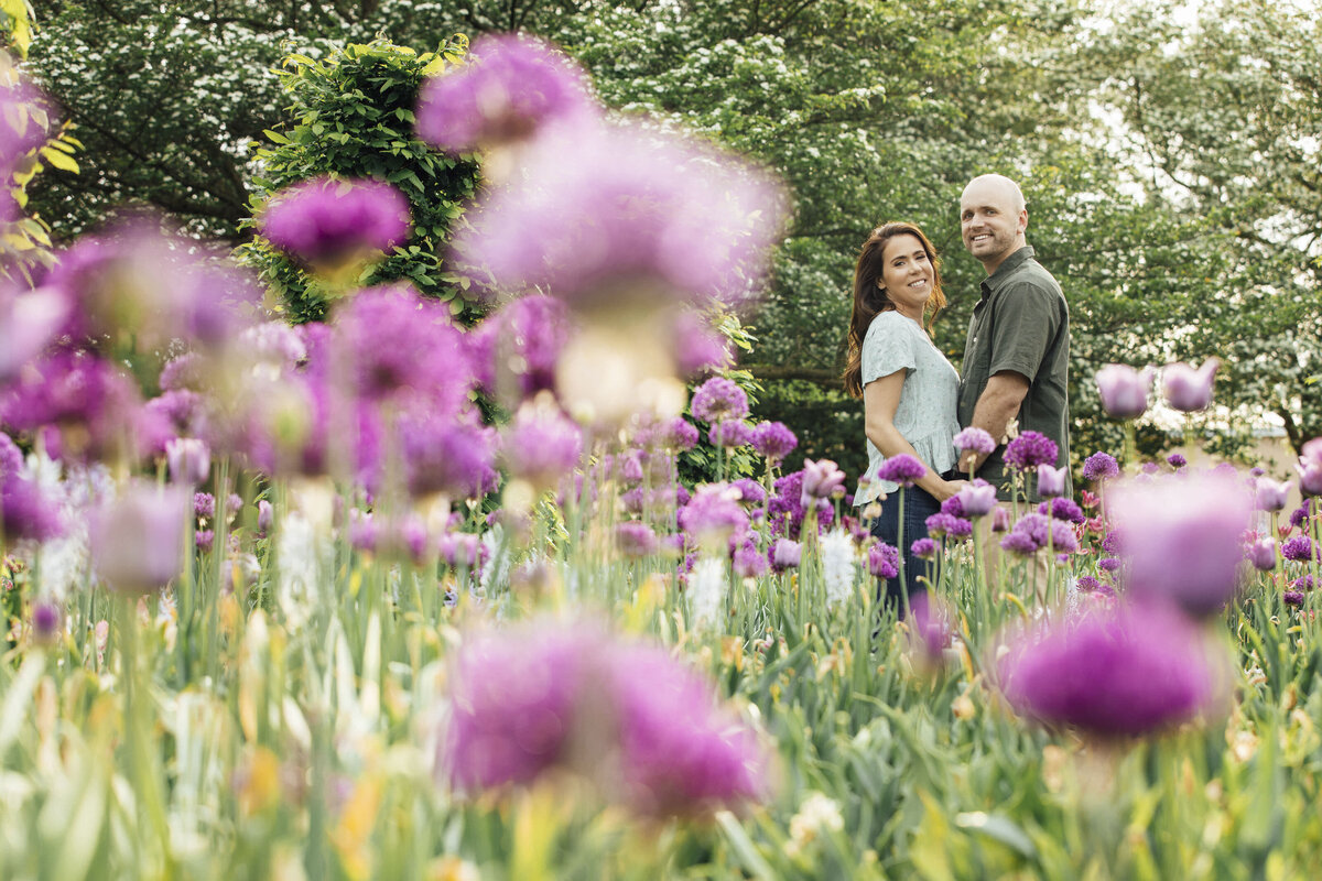 Couple holding hands during pre-wedding photo at Longwood Gardens in Kennett Square Pennsylvania