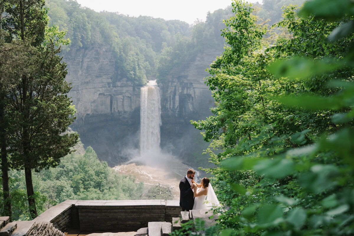Wedding guests looking at bride as she walks down the aisle at Finger Lakes wedding NY