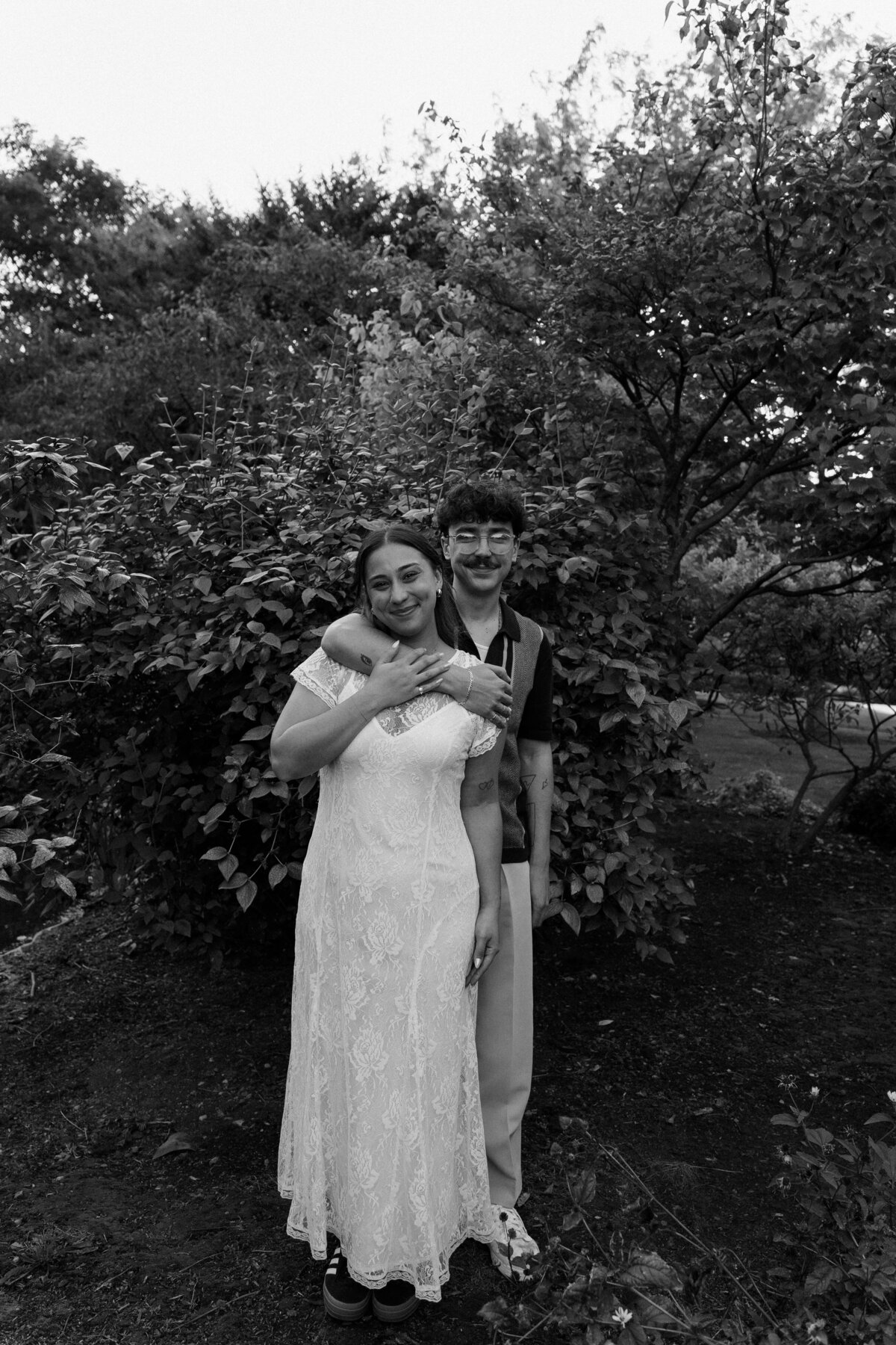 black and white overlay,  couple hugging outdoors