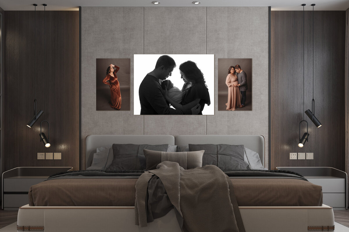 High end modern bedroom with grey walls and wooden panels, taupe bedding and three pieces of portrait artwork on the wall above bed