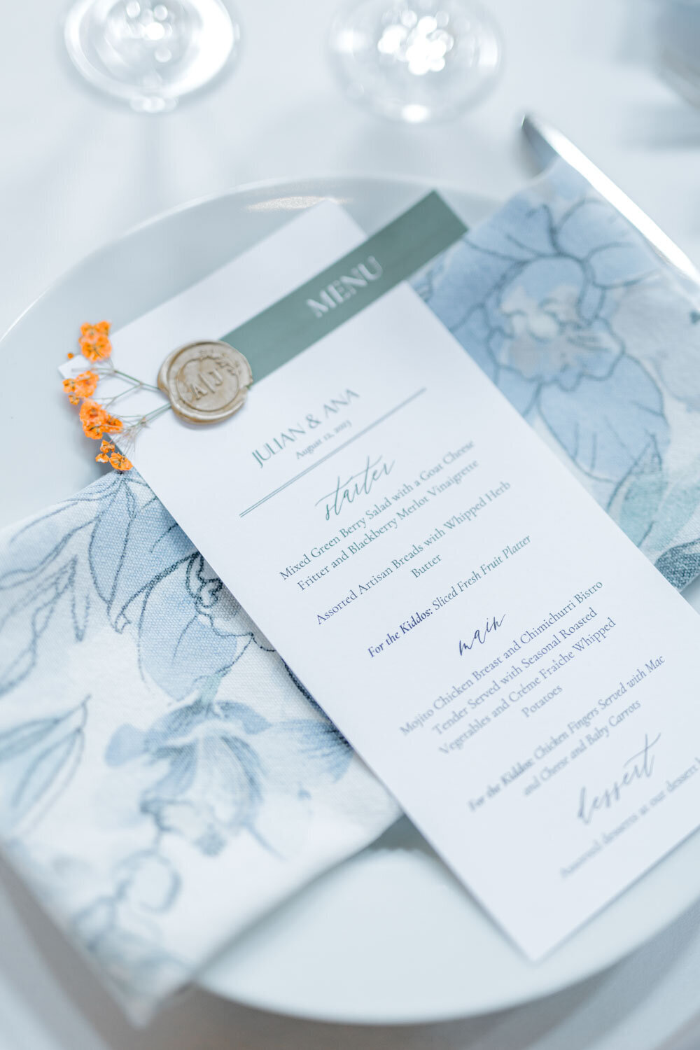 Elegant wedding menu with a blue napkin